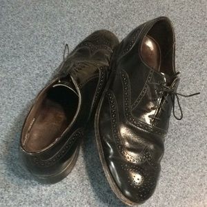 Men’s black wingtips